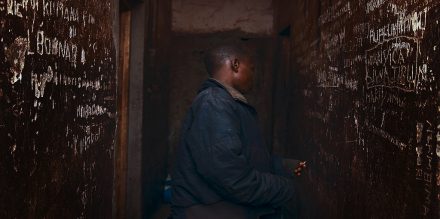 11 year old Marie, arrested for theft of a mobile phone, alone in a prison cell in Buhinjuza, Burundi. Photo by Nathalie Mohadjer.